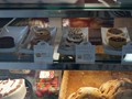 Churros, Milk Cake, Empanadas in Display Case